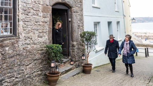 Visitors walking to the entrance of the Tudor merchant’s House Tenby
